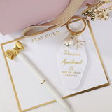 WHITE PARISIAN KEYCHAIN